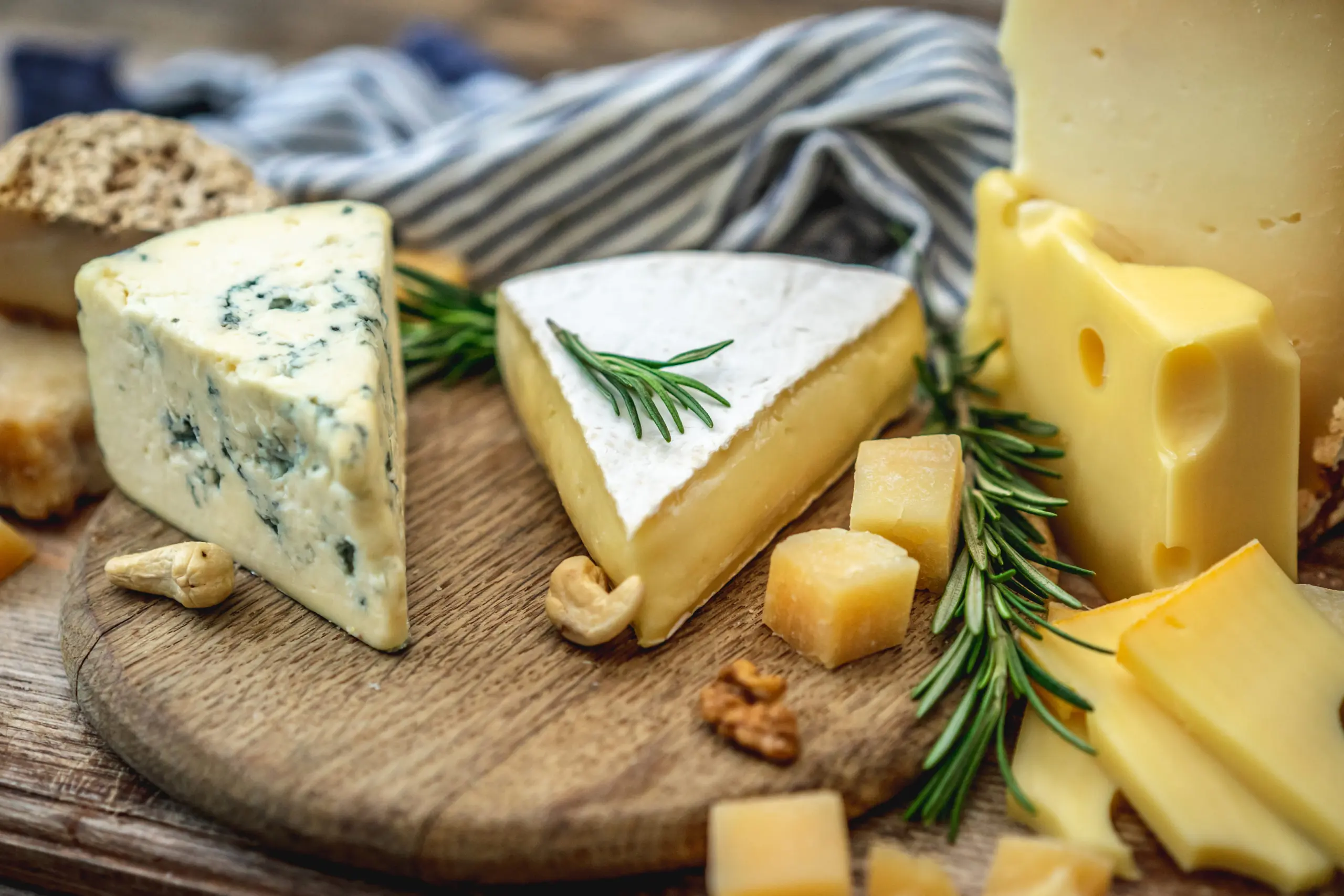 delicious-cheeses-displayed-on-a-wooden-board-2026-09-24-11-36-41-utc (1)
